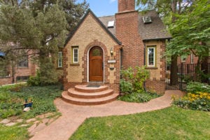 Sold! Vintage brick Tudor with “secret garden” yard on premier block